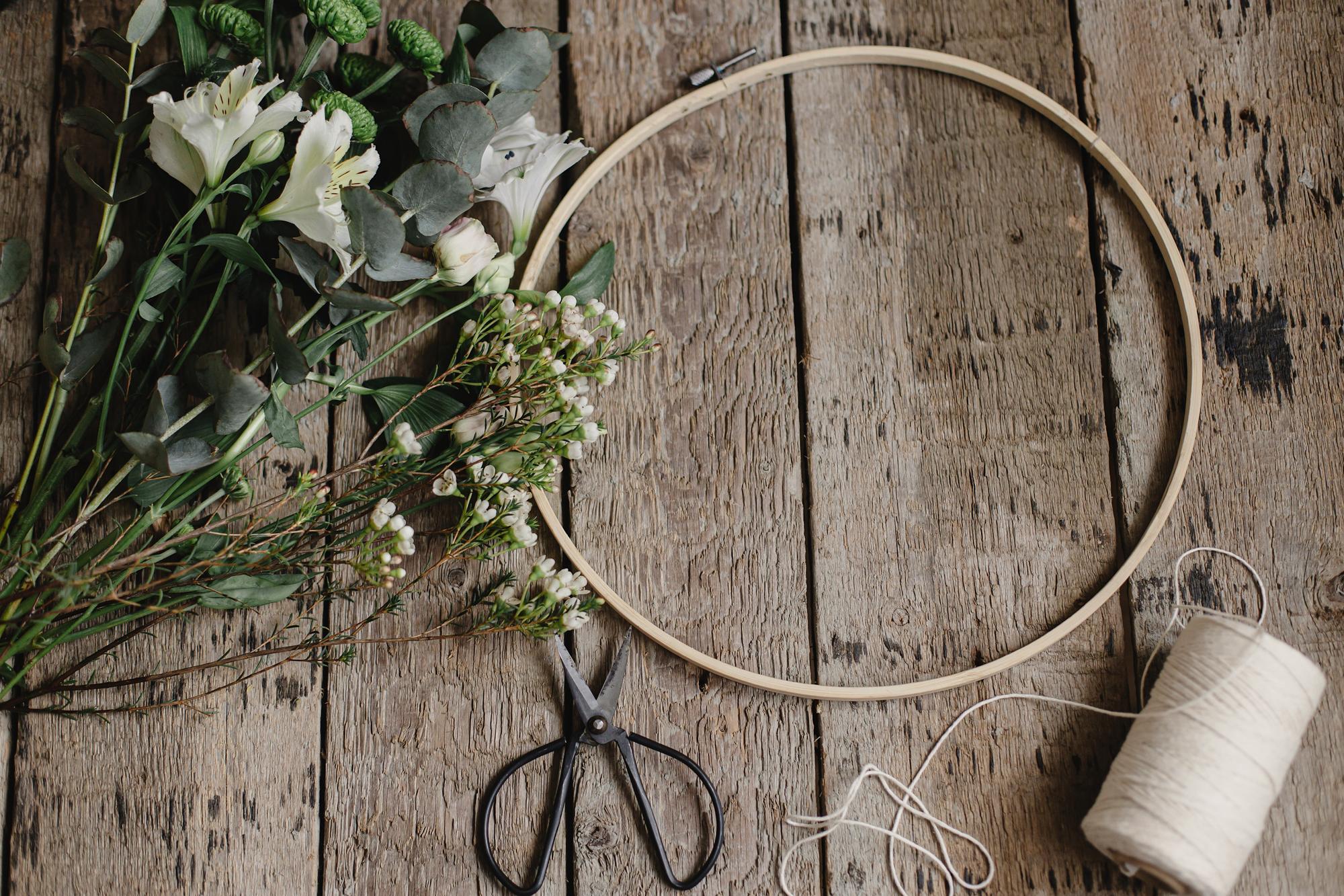 artisan hoop with embroidered floral detail on neutral fabric