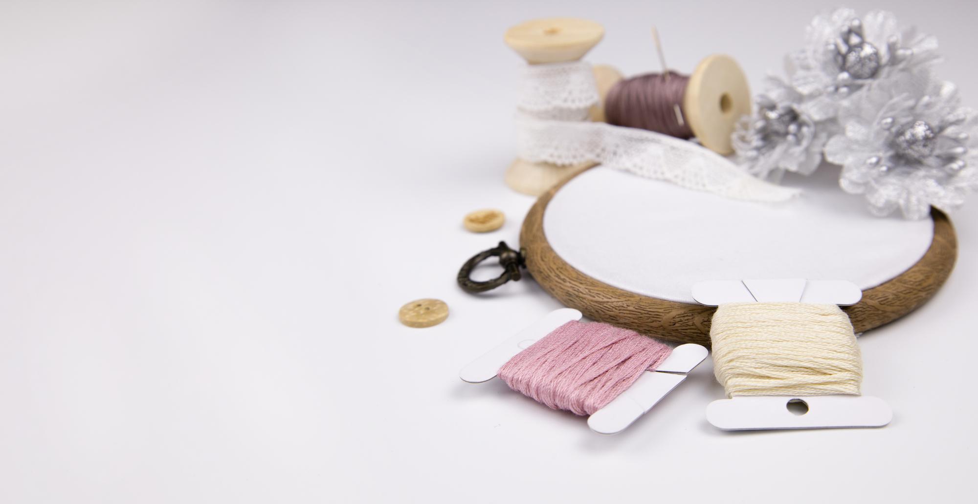 studio table with threads and hoop