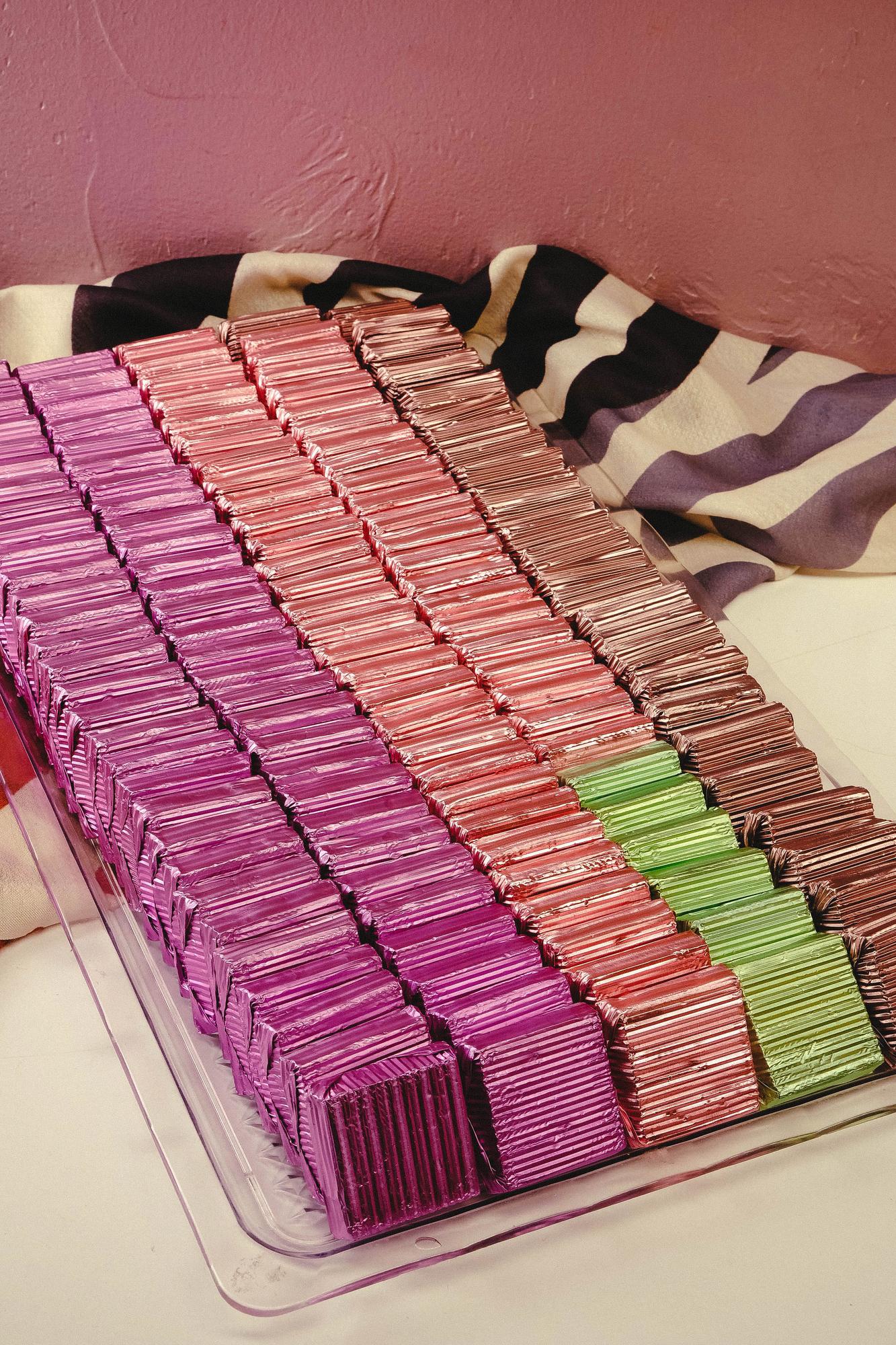 stack of embroidered swatches in neutral palette